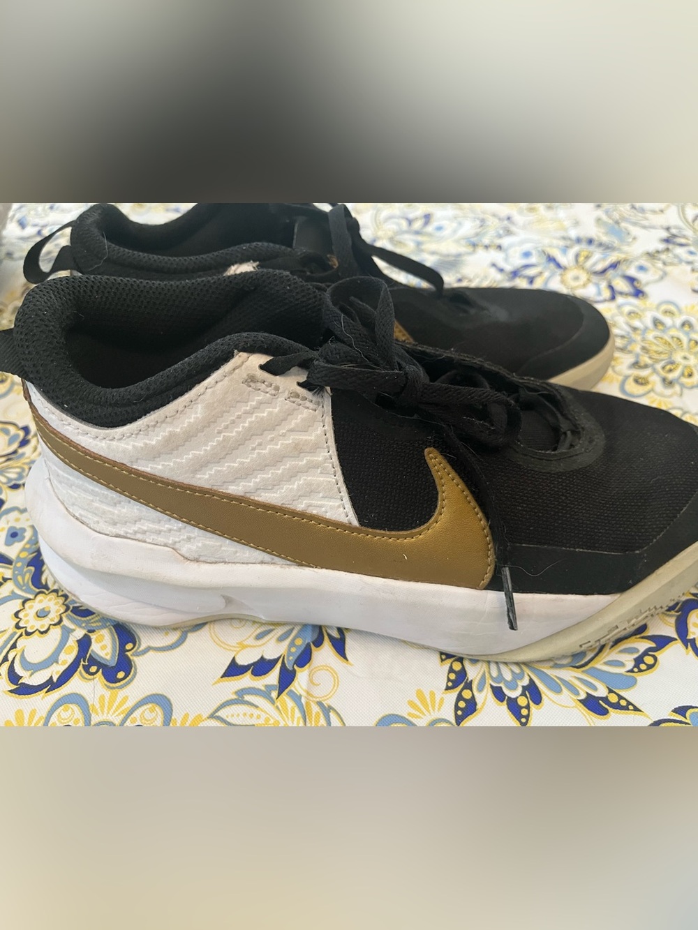 Nike Hustle DX Black White Gold Low-Top Youth Sneakers